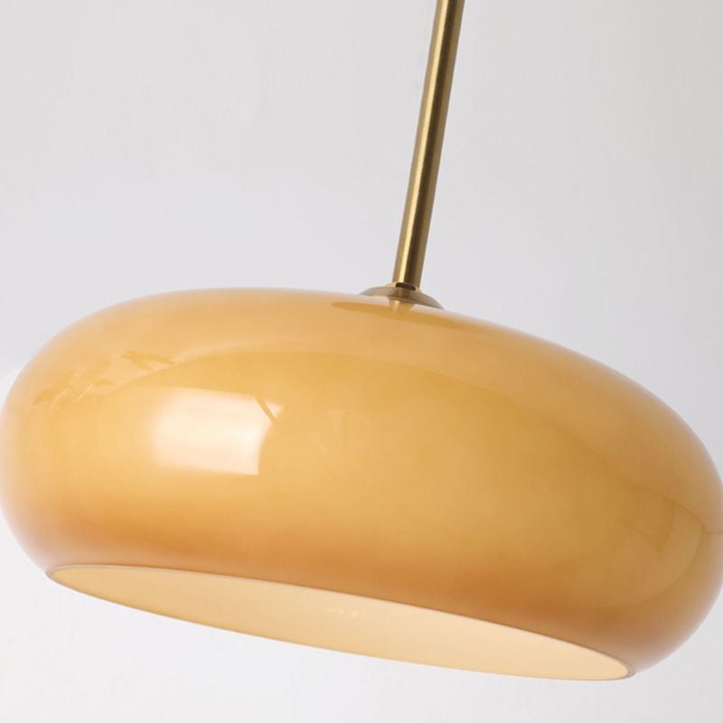 Underside view of Hailie orange glass dome and metal stem