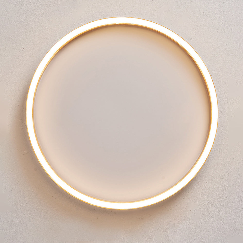 Underside view of the Ozawa circular wood-rim light with its illuminated outer ring.