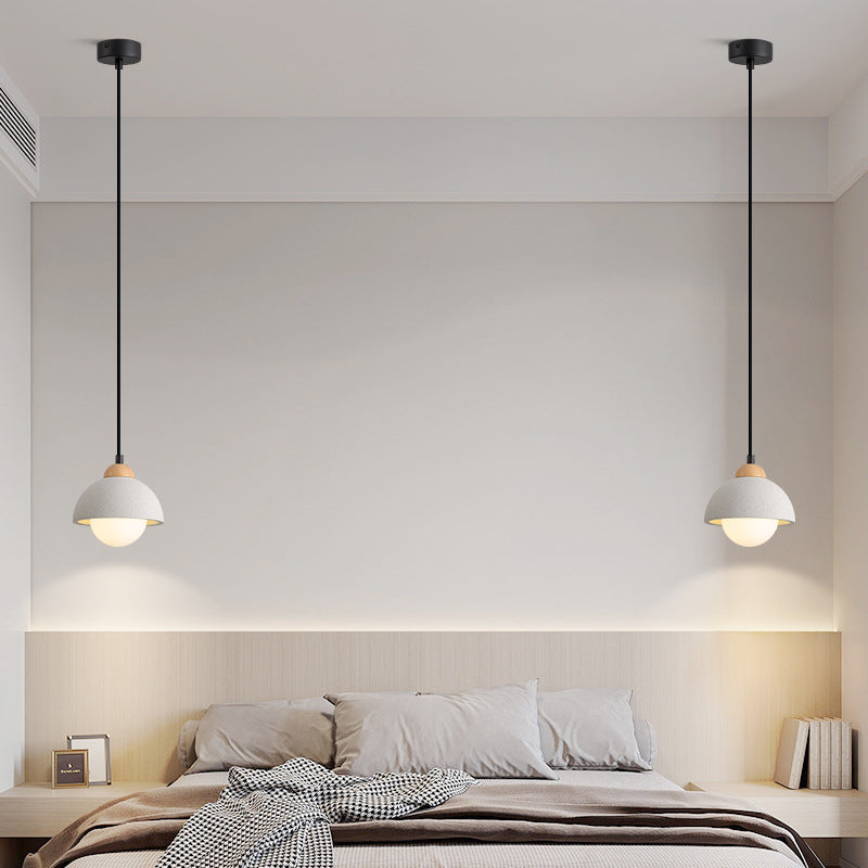 Two Style A Ozawa pendants positioned on either side of a bed.