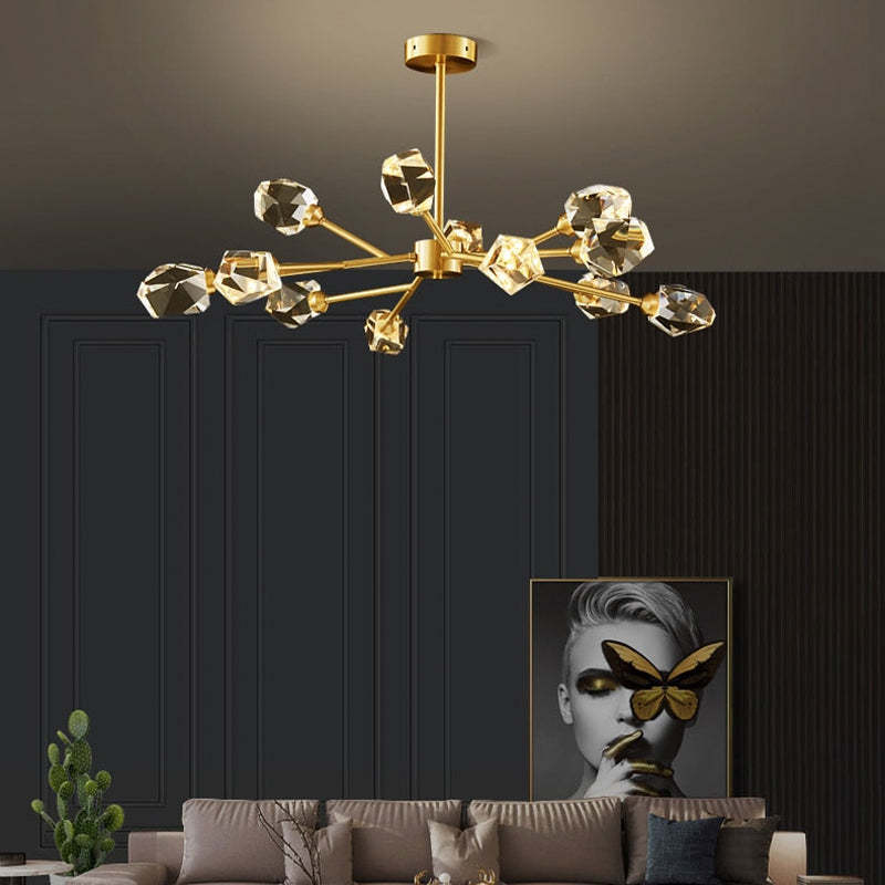 Kristy 12-light option above a gray sofa, cactus and framed monochrome face with a gold butterfly against dark wall panels.