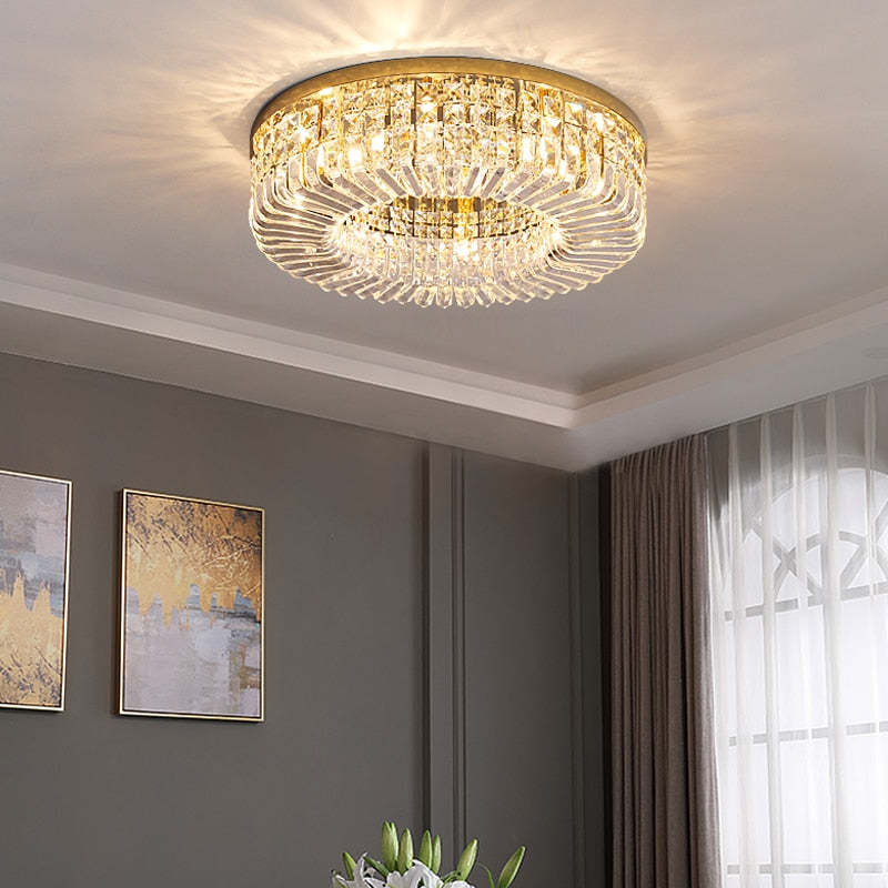 Golden Marilyn in a gray-panel room with two gold-and-gray abstract prints, gray curtains and an arched window pattern.