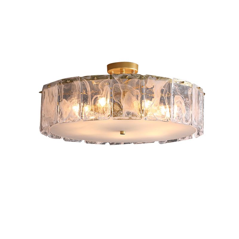 23.6-inch Kirsten option on white, with a broad glass-panel ring, lit example bulbs, pale bottom plate and gold-toned canopy.