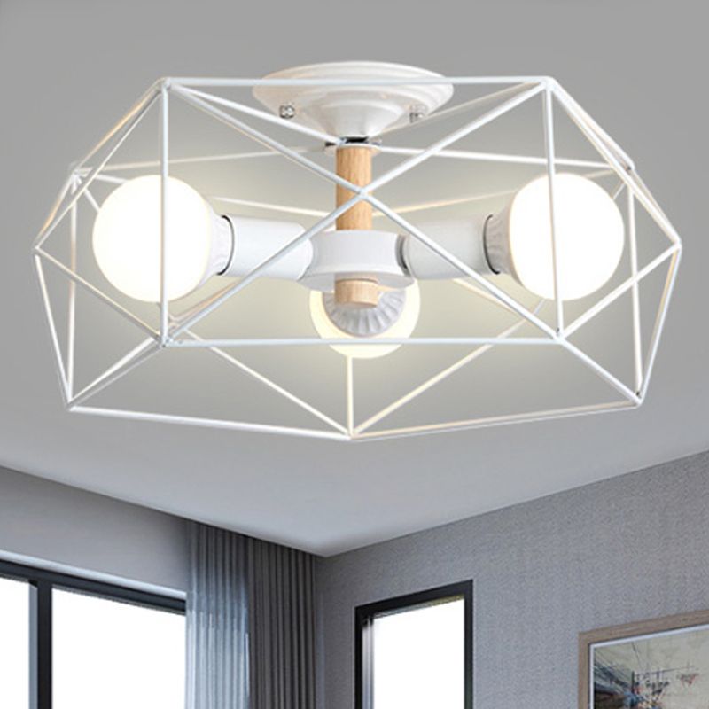 White three-light Cooley lantern near a grey textured wall, curtains, dark window frame and the top of framed artwork.