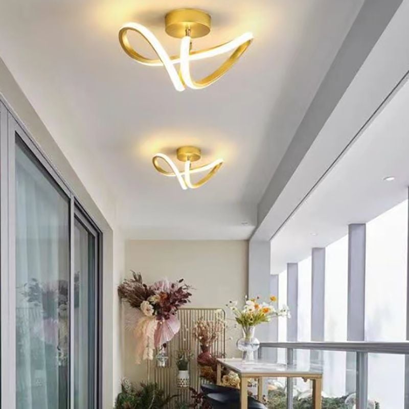 Two gold Lacey loop ceiling lights along a bright hallway