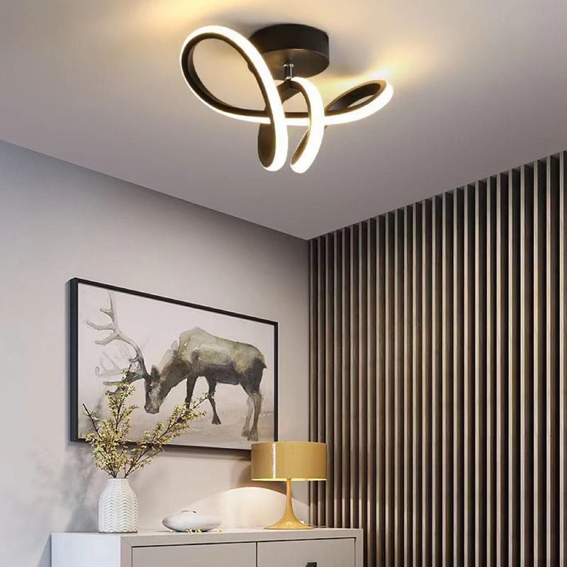 Black Lacey ceiling light above a cabinet near a striped wall