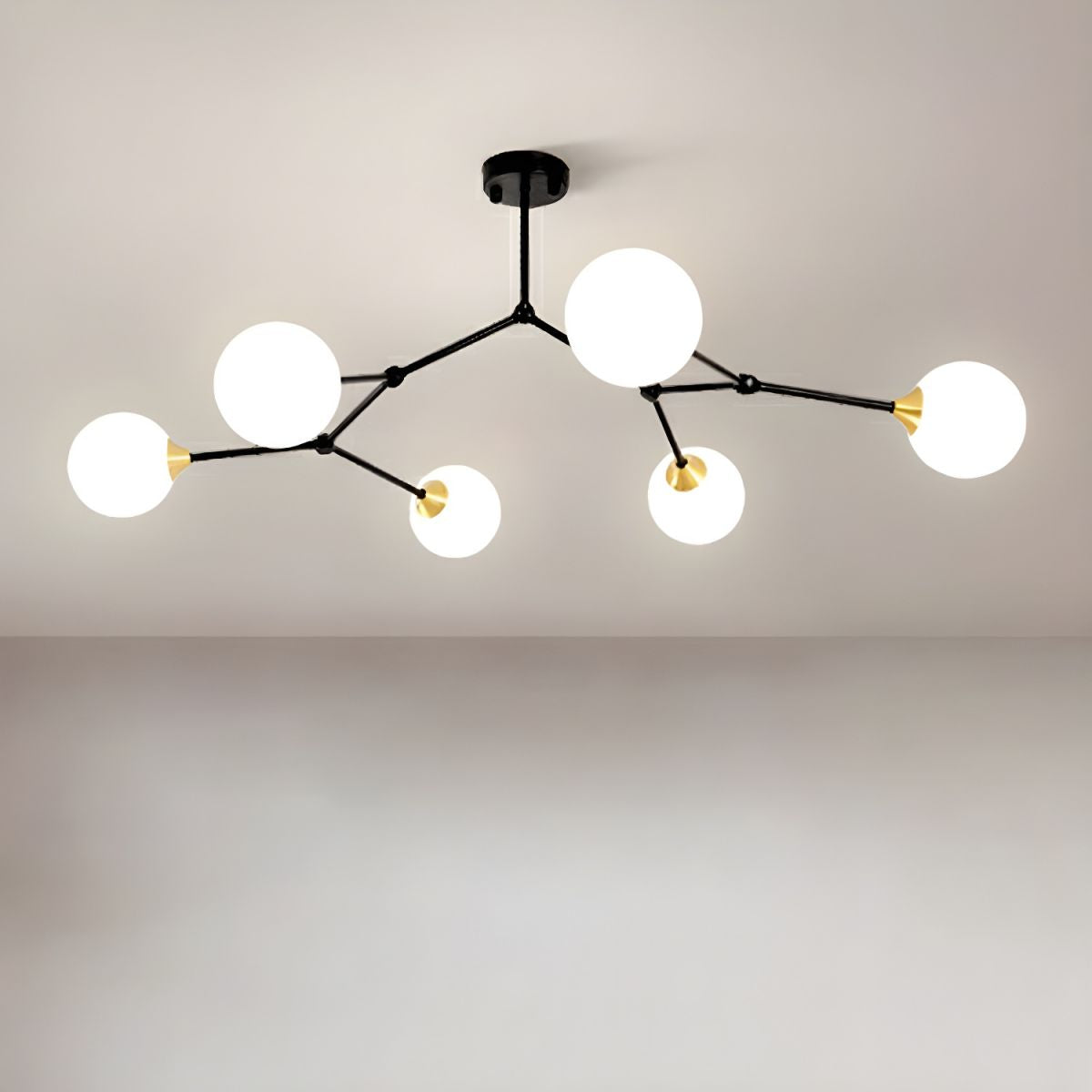Six-globe black Valentina chandelier installed on a ceiling