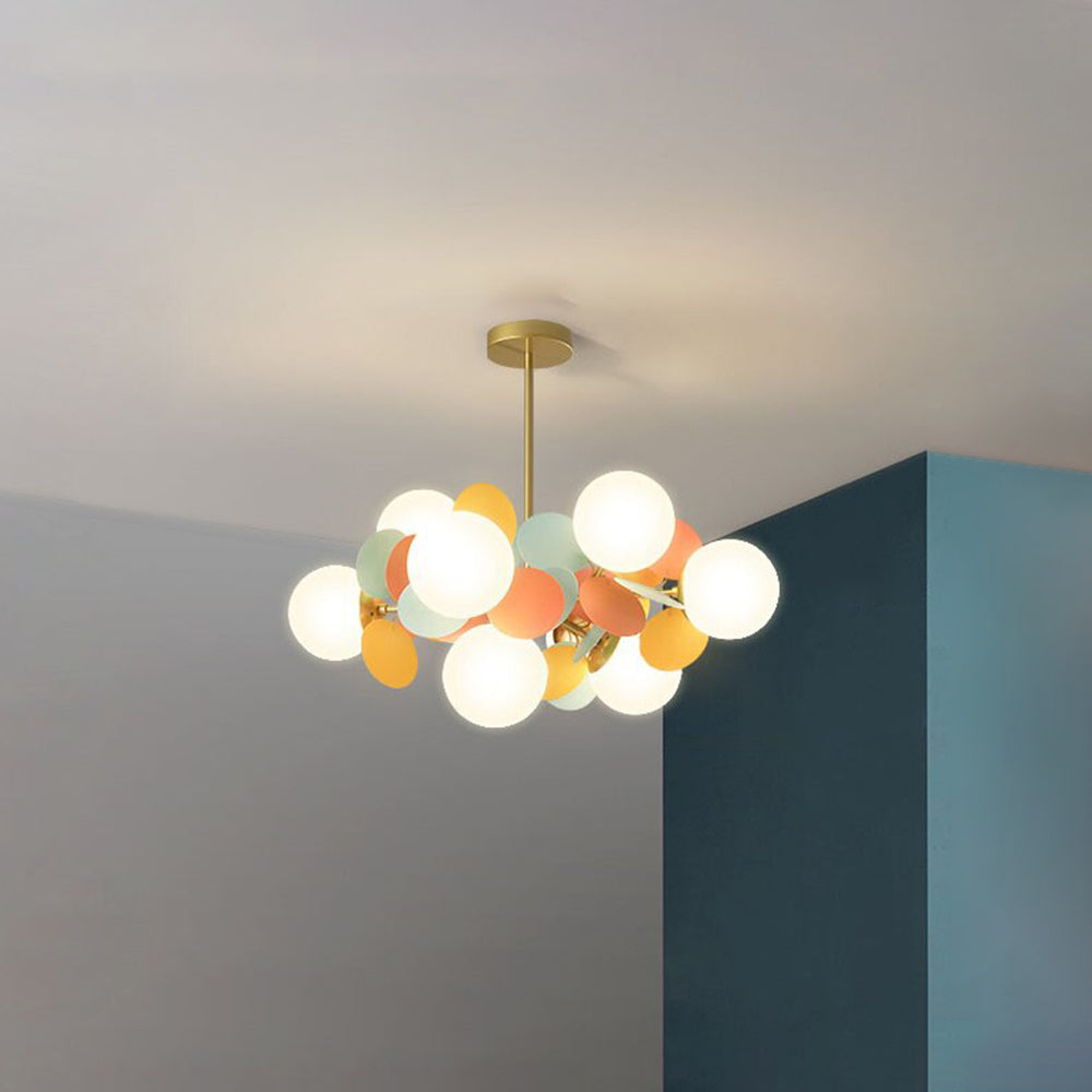Jevon Color 28.3-inch 8-light option with white globes and colourful oval petals beside a teal wall corner.