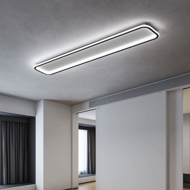 Illuminated Edge rounded rectangle ceiling light above a gray room