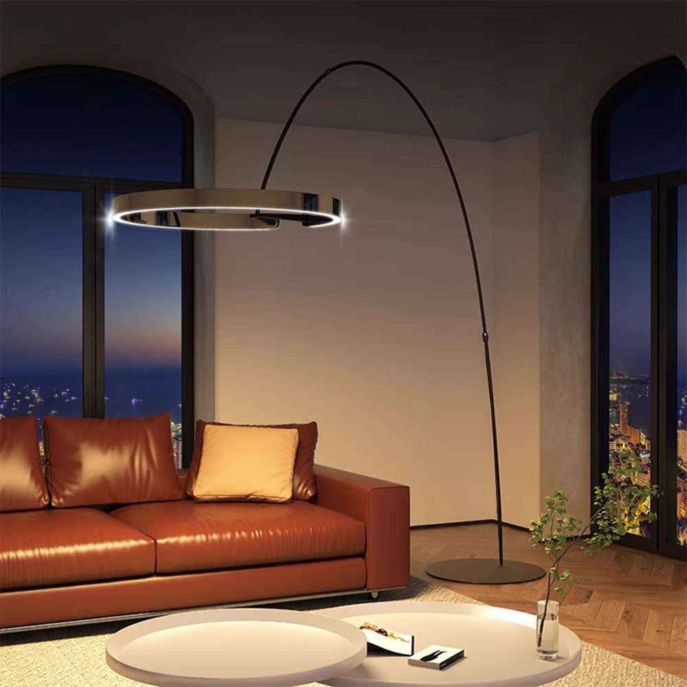 Edge arched ring floor lamp beside an orange sofa