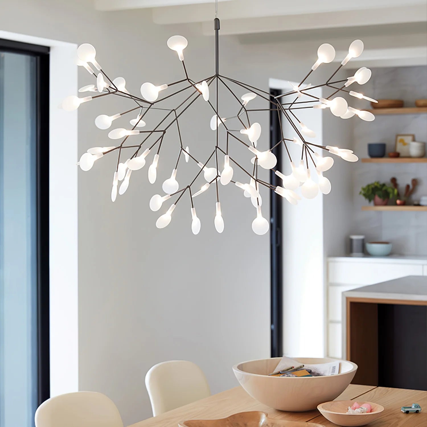 Black branching arms above a round table