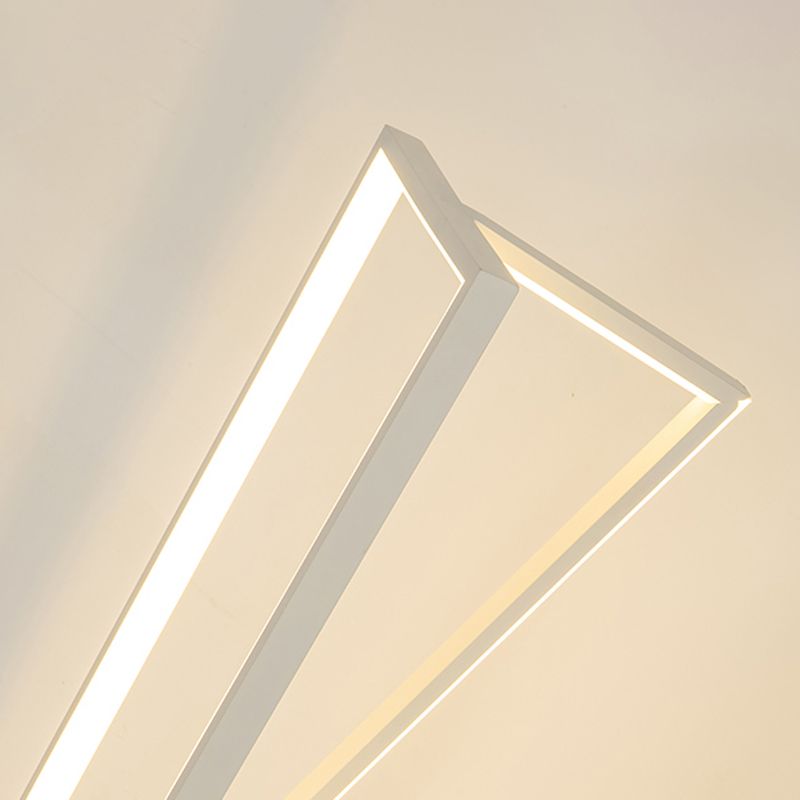 Angled close-up of the white upper triangular frame and its glowing linear strips