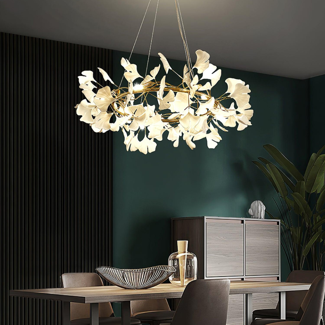 Gold-colour leaf chandelier in a dark dining interior