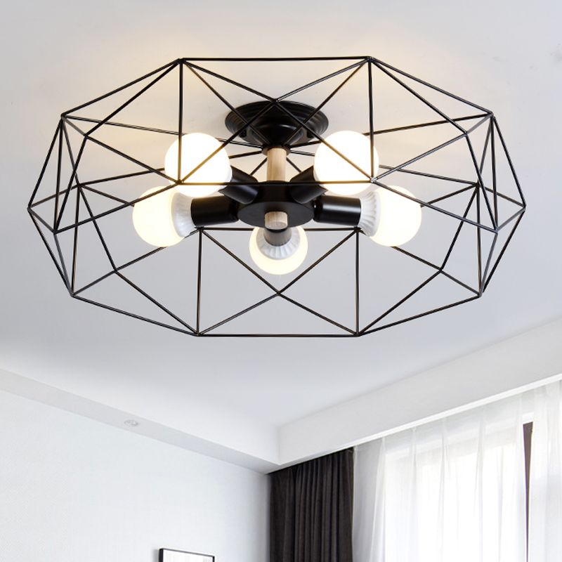 Black five-light Cooley lantern with radial bulb holders inside one open polygon frame, near dark drapes and a sheer window curtain.