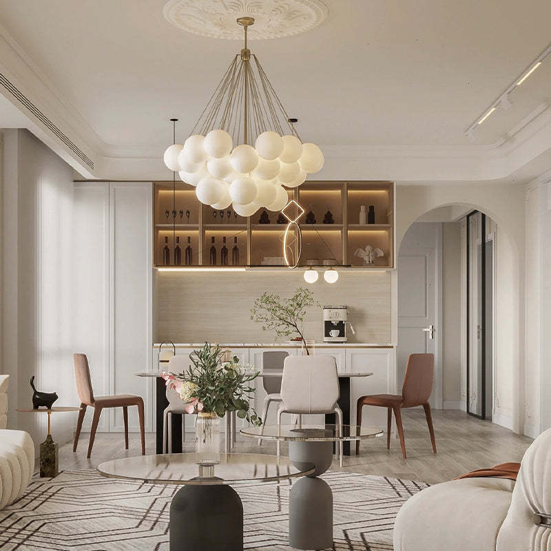 Gold globe pendant in a living and dining space