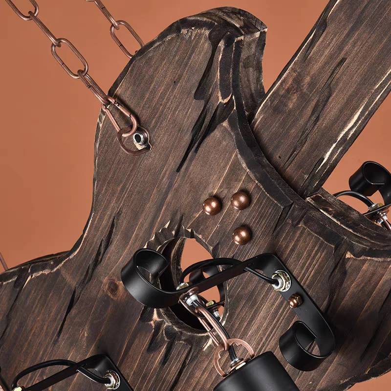 Close view of Austin wood-grain guitar body, metal brackets and chain attachments