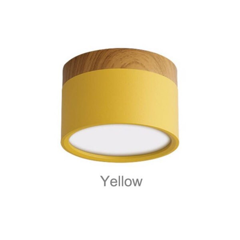 Yellow Morandi cylinder with wood-look upper trim and pale circular face, labeled Yellow on white backdrop.