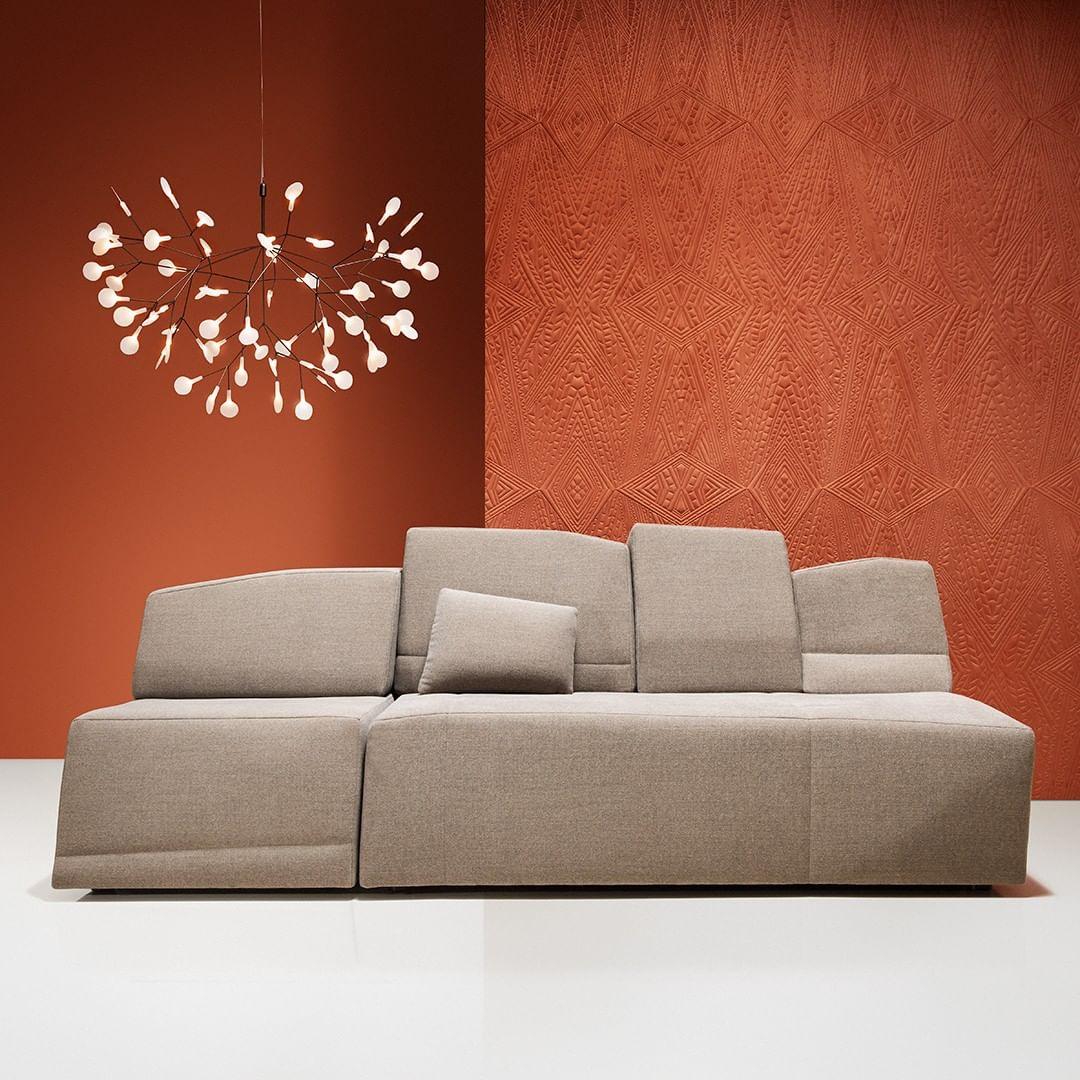 Small rounded chandelier above a sofa
