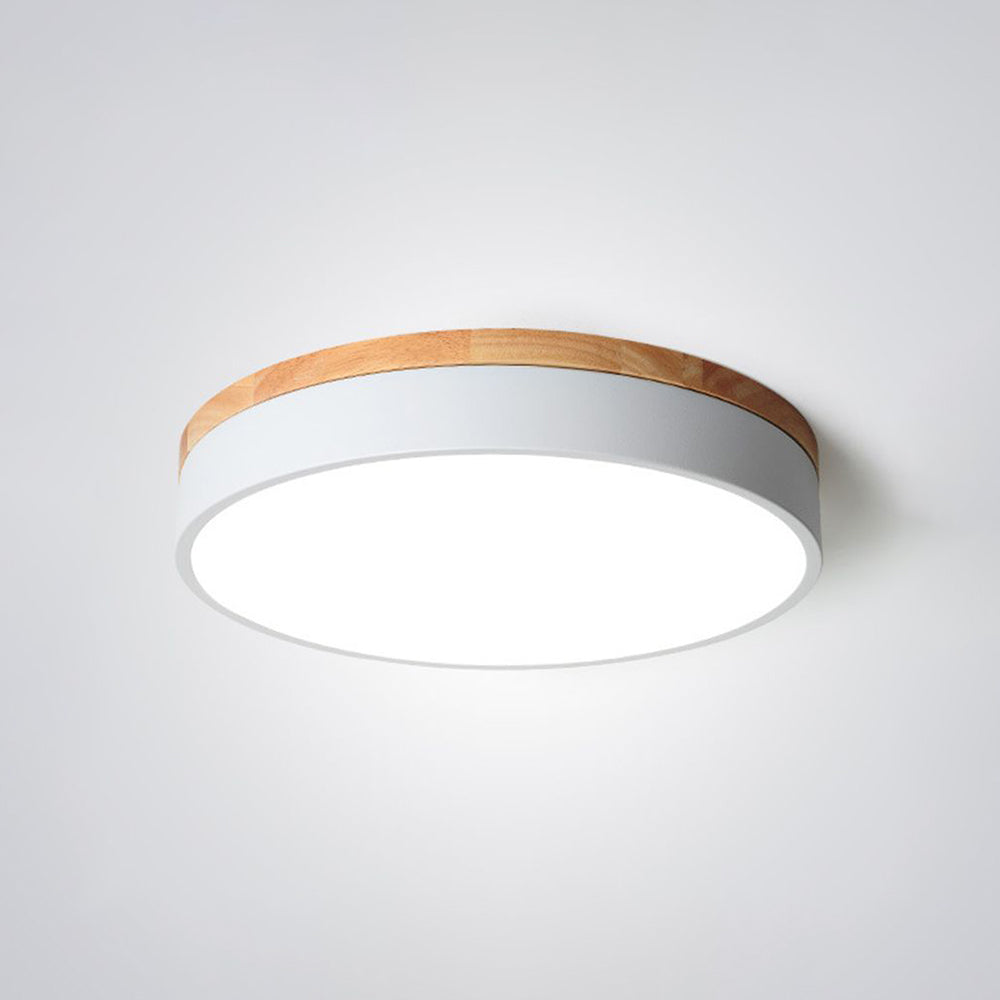 Angled close view of Morandi with a white side band, wood-tone upper trim and broad bright circular face.