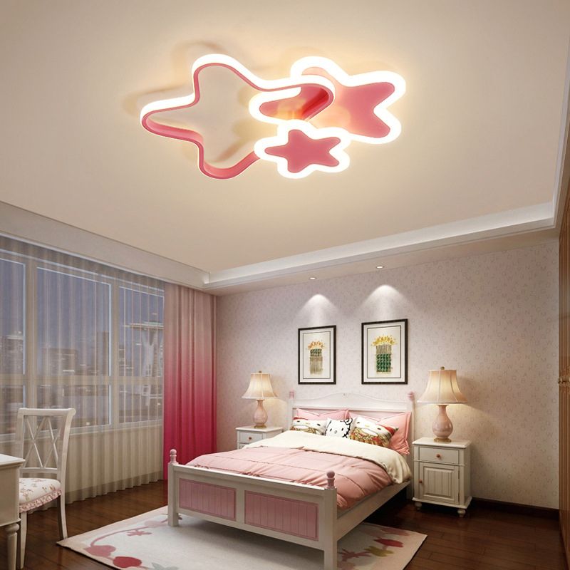 Pink Morandi star ceiling light above a bed beside pink curtains.