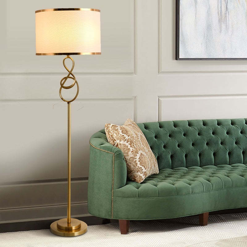 Tall white-shade Sano floor lamp in a living-room setting