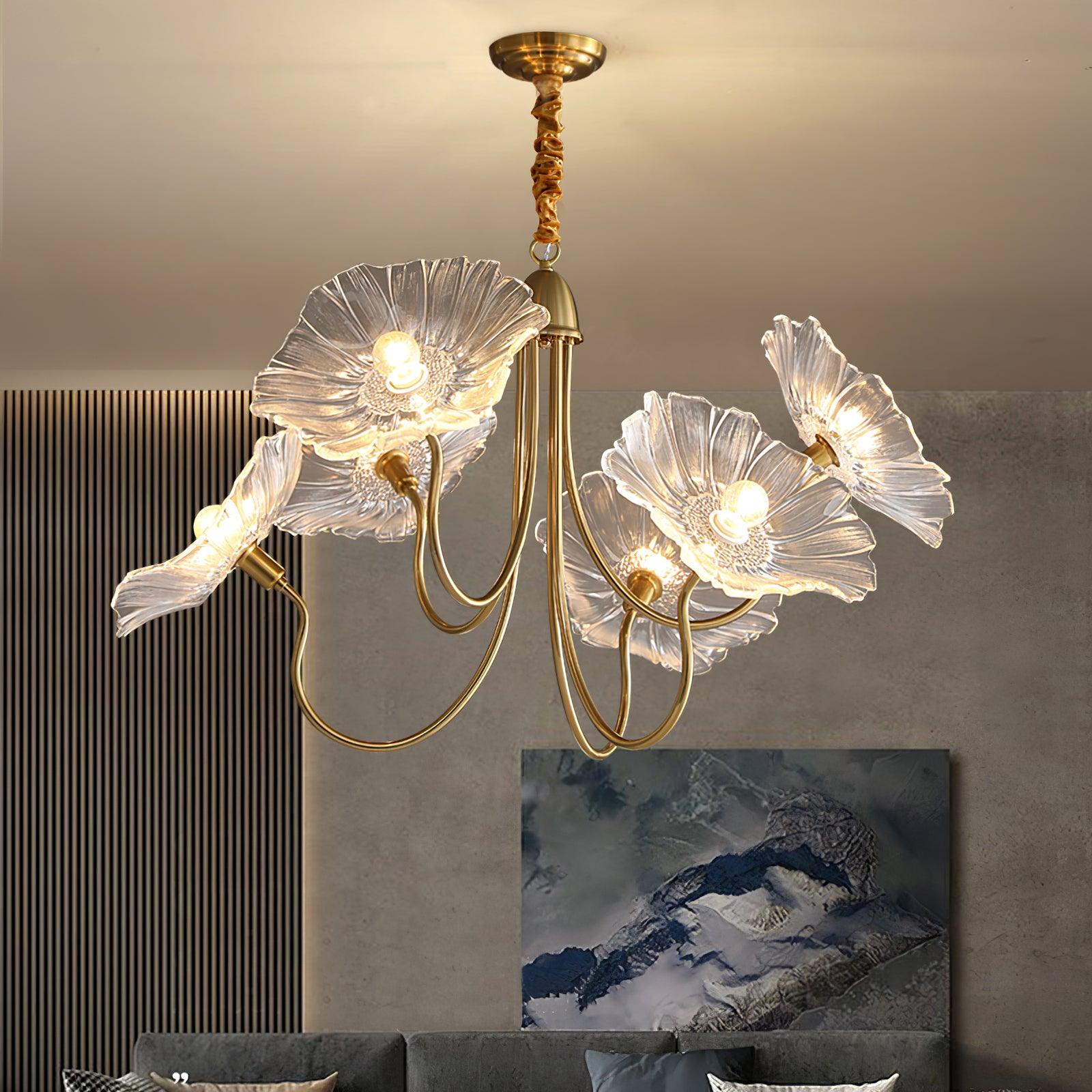 Clear glass flowers on chandelier near grey wall