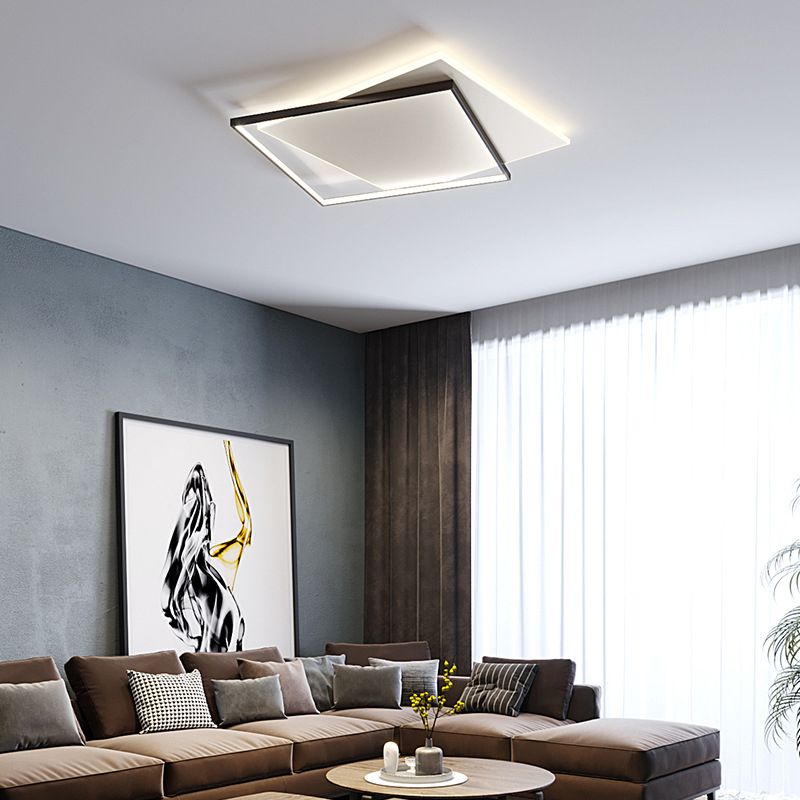 Quinn layered square light above a brown sectional sofa and round coffee table, with abstract wall art and full curtains.