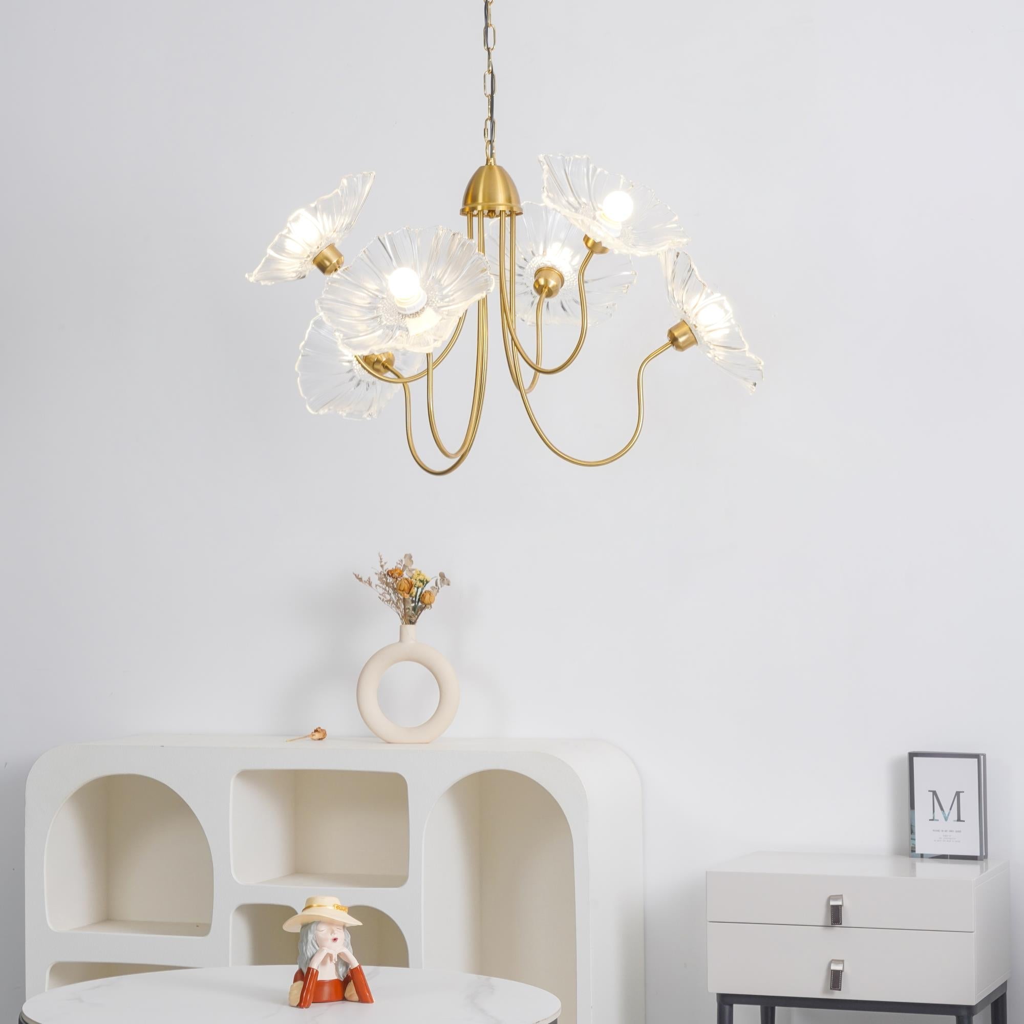 Clear chandelier above sculptural console