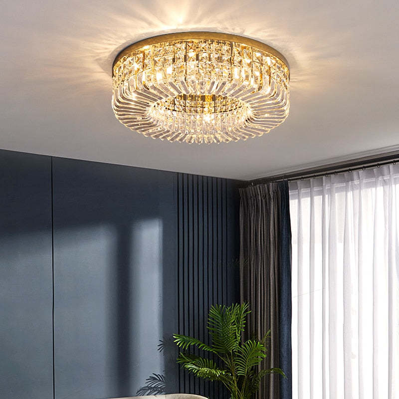 Golden Marilyn above dark blue wall panels beside a palm plant, gray curtains and white sheers.