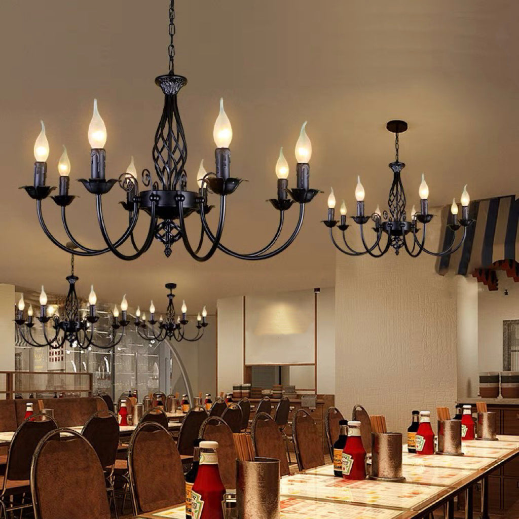 Black Silva eight-light chandeliers above indoor restaurant tables and chairs, with condiment bottles in foreground