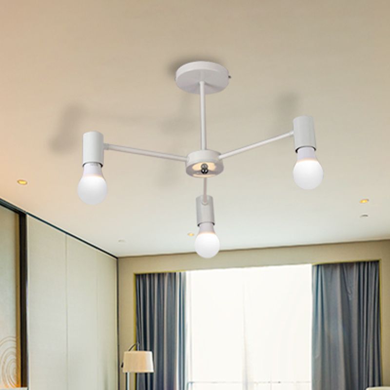 White three-light ceiling fixture with short post and round canopy beside a curtained window