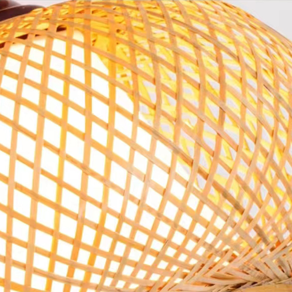Close-up of Muto’s crossing tan woven strips and warm-lit gaps, with a pale circular rim at the lower edge.