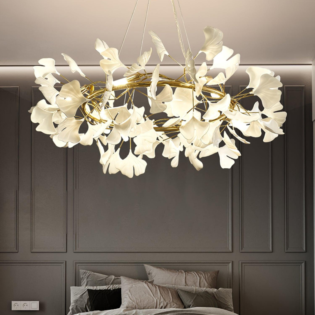 Illuminated white-leaf chandelier in a bedroom