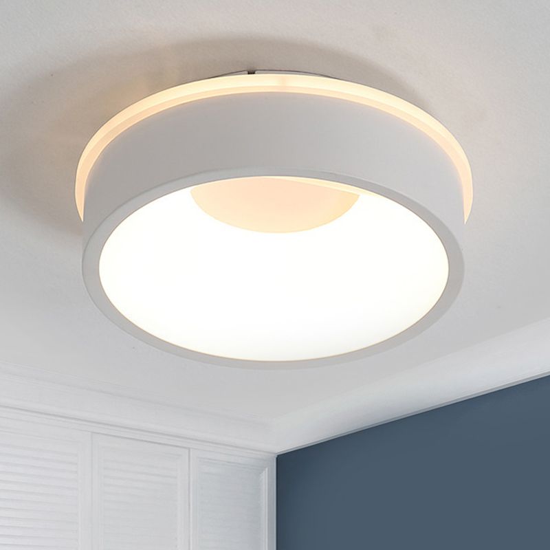 White Quinn Style A round ceiling light above a bed