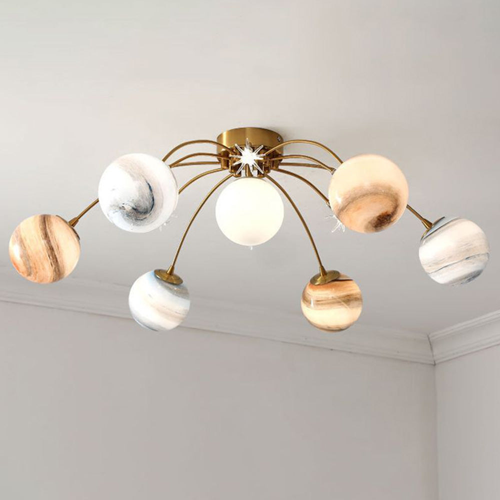 Elif illuminated at the ceiling, with a bright pale central globe, glowing patterned globes and small star-shaped details.