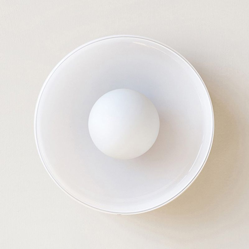 White Morandi round shade and central globe bulb seen from below