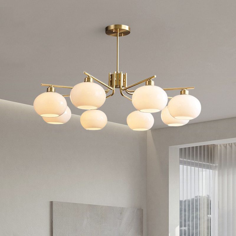 Valentina brass-finish multi-light chandelier in a living room