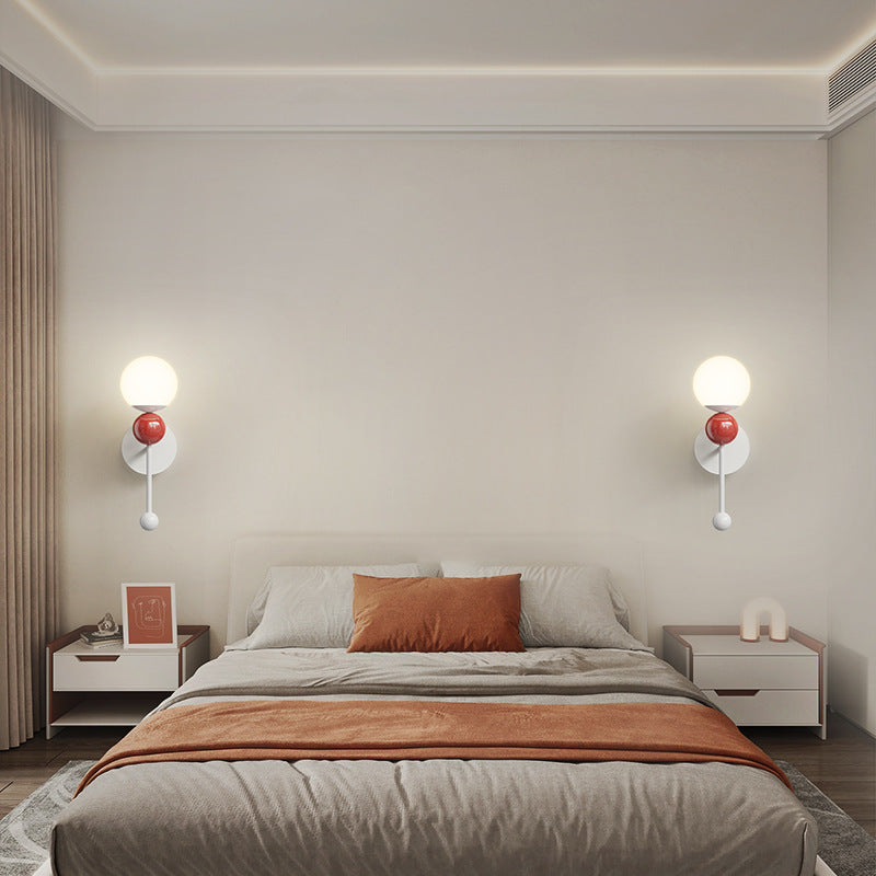 Two red-accent Hailie wall lights flanking a bed