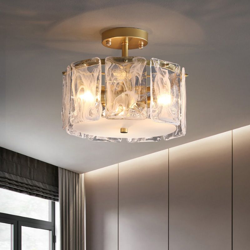 15.7-inch Kirsten glass-panel light near a dark-framed window, blinds, grey curtains, wall panels and a ceiling-edge light band.