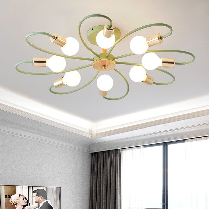 Green eight-head ceiling light glowing above a living-room window with curtains and a wall portrait