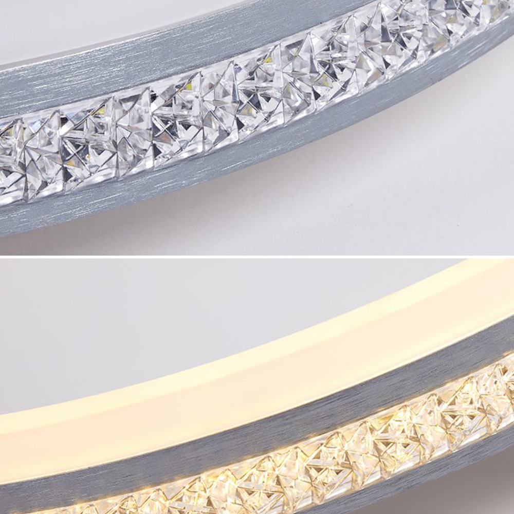 Two close-up views of Quinn’s faceted clear-looking rim pieces between brushed silver-gray bands, with one diffuser shown lit.