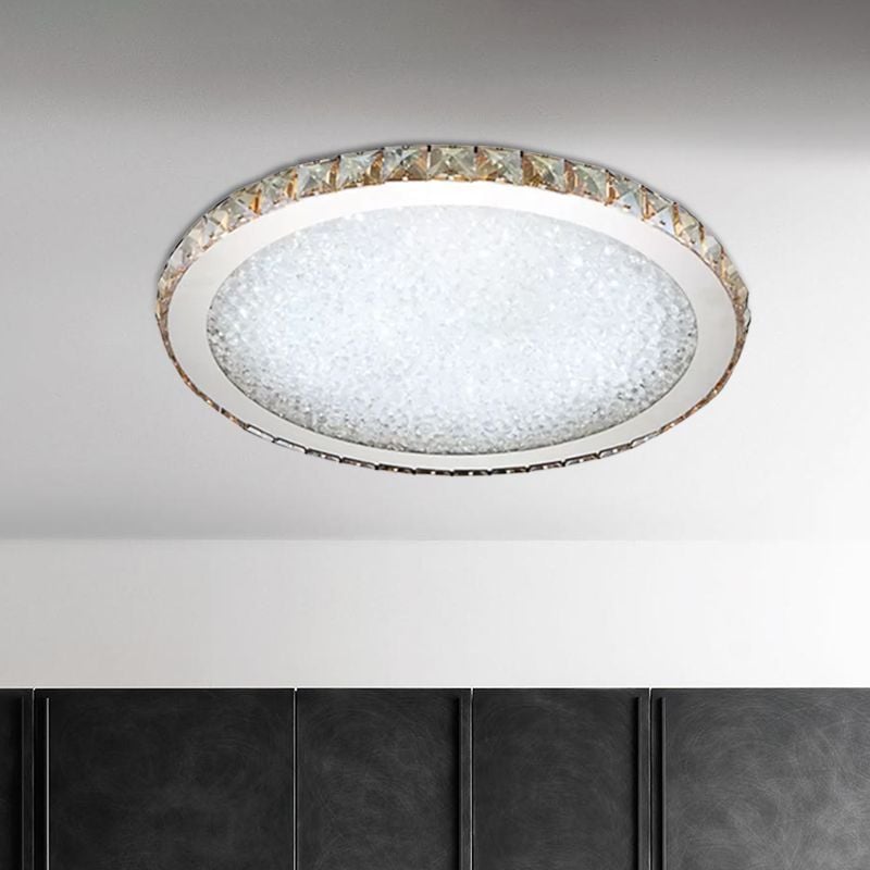 Clear Kristy ceiling light with a faceted rim and textured luminous center