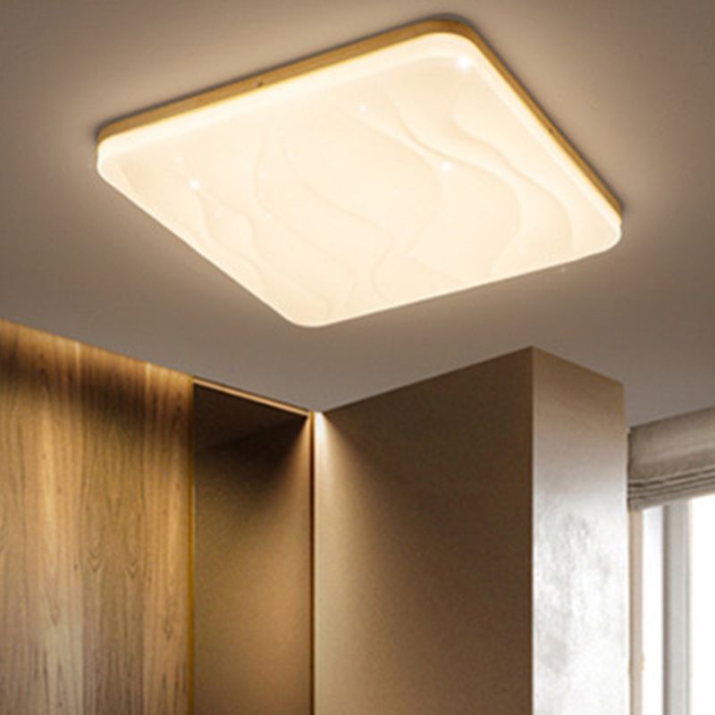 Square Ozawa bright rippled face above a wood wardrobe panel with an open compartment beside a pale window blind.