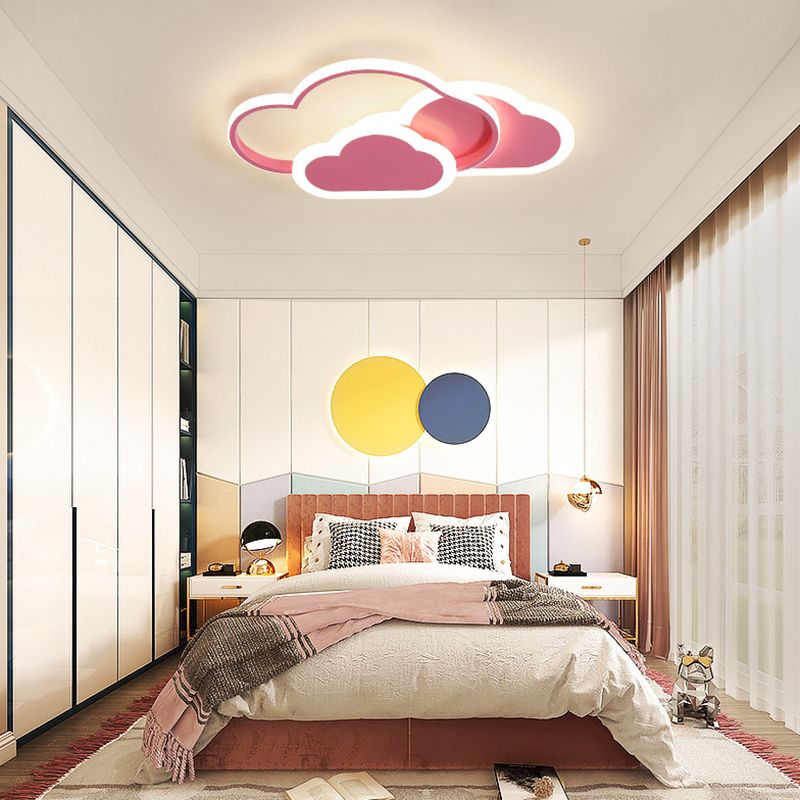 Pink Morandi cloud ceiling light in a bedroom with colourful circular wall accents.