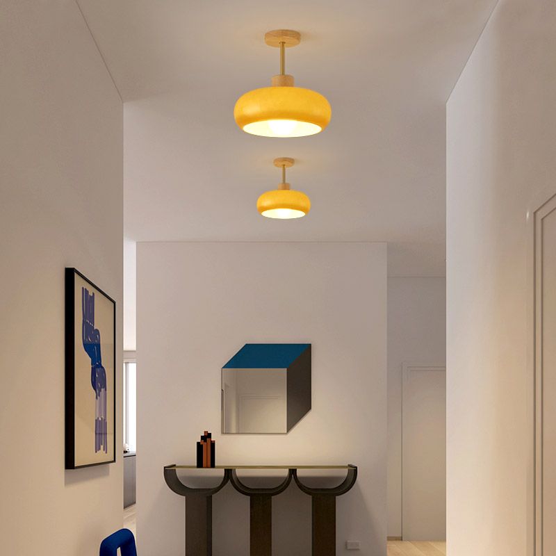 Two orange Hailie ceiling lights in a narrow hallway