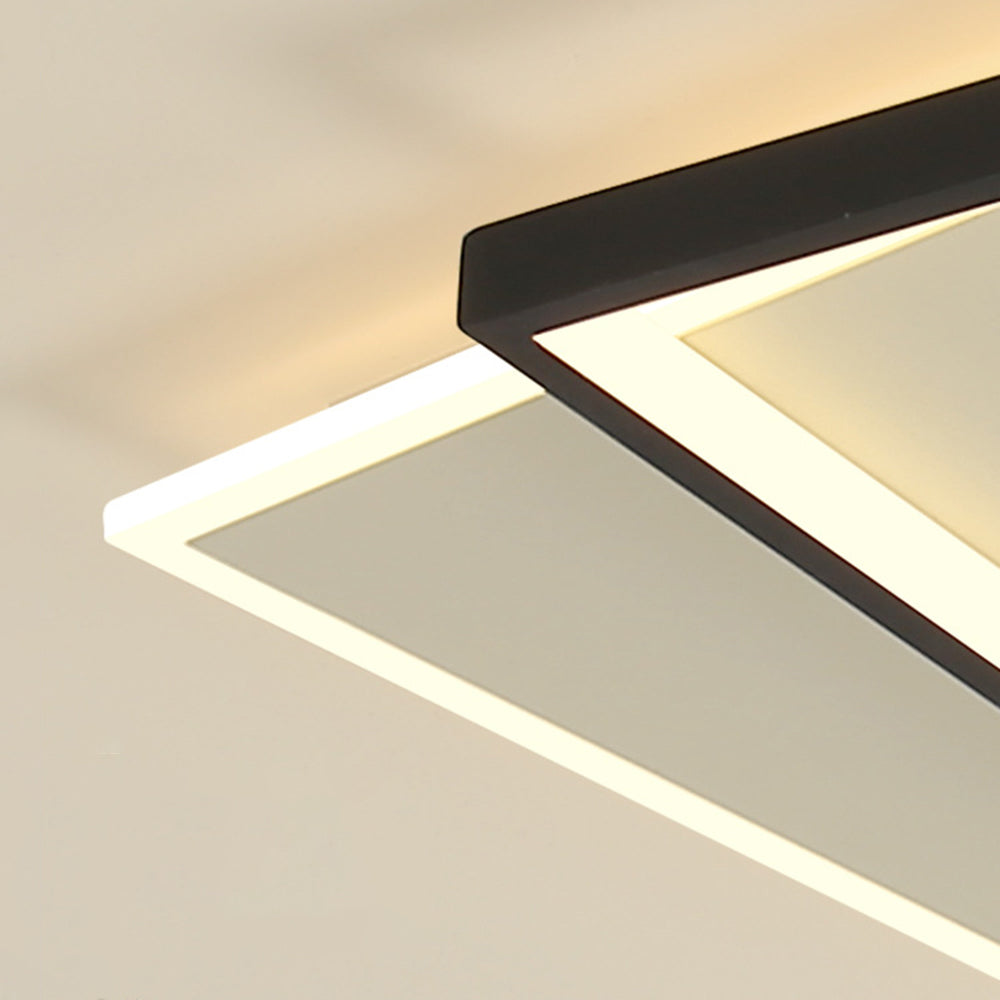 Installed square Quinn corner with black rim crossing above white rear panel and both luminous channels.