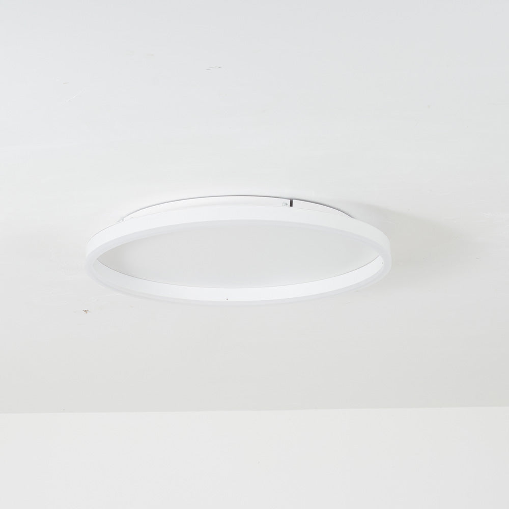 White Arisha open ring installed on a pale ceiling, with an upper plate and mounting hardware visible inside the outline.