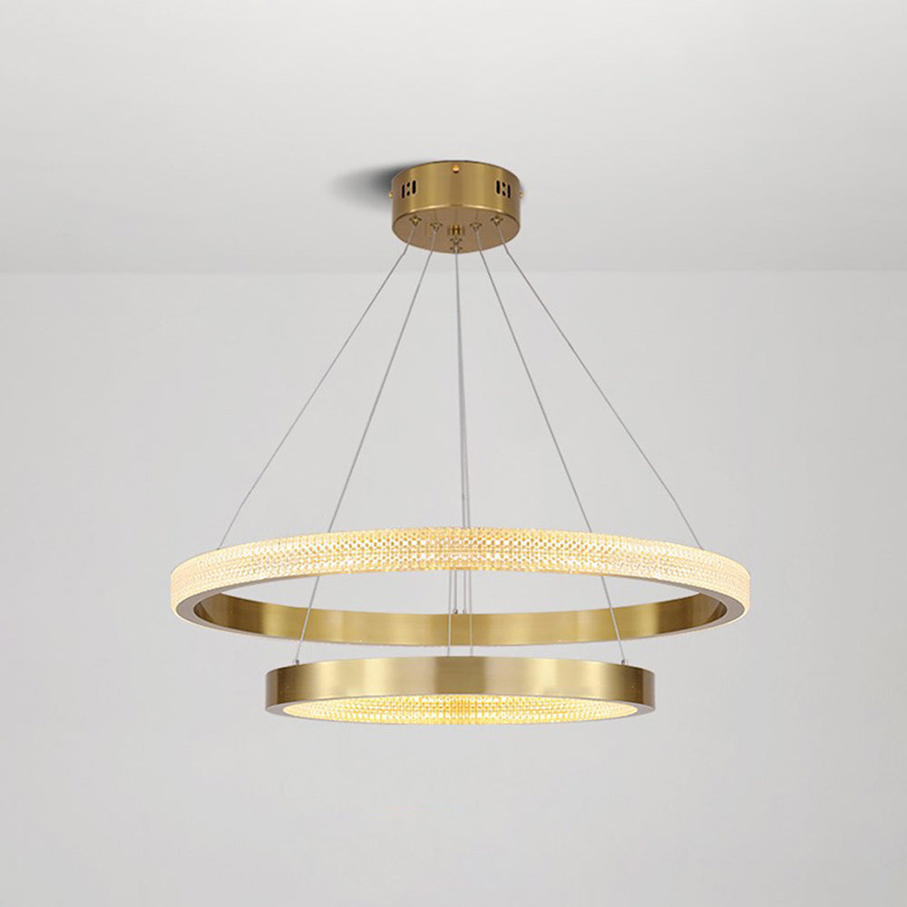 Kirsten two gold rings suspended below a round ceiling canopy