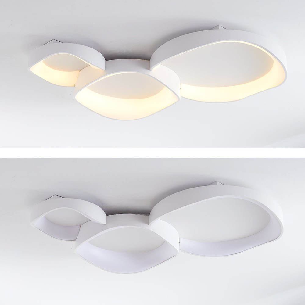 Original two-panel image of three white Arisha wave bowls, with warm-looking illumination above and unlit below.