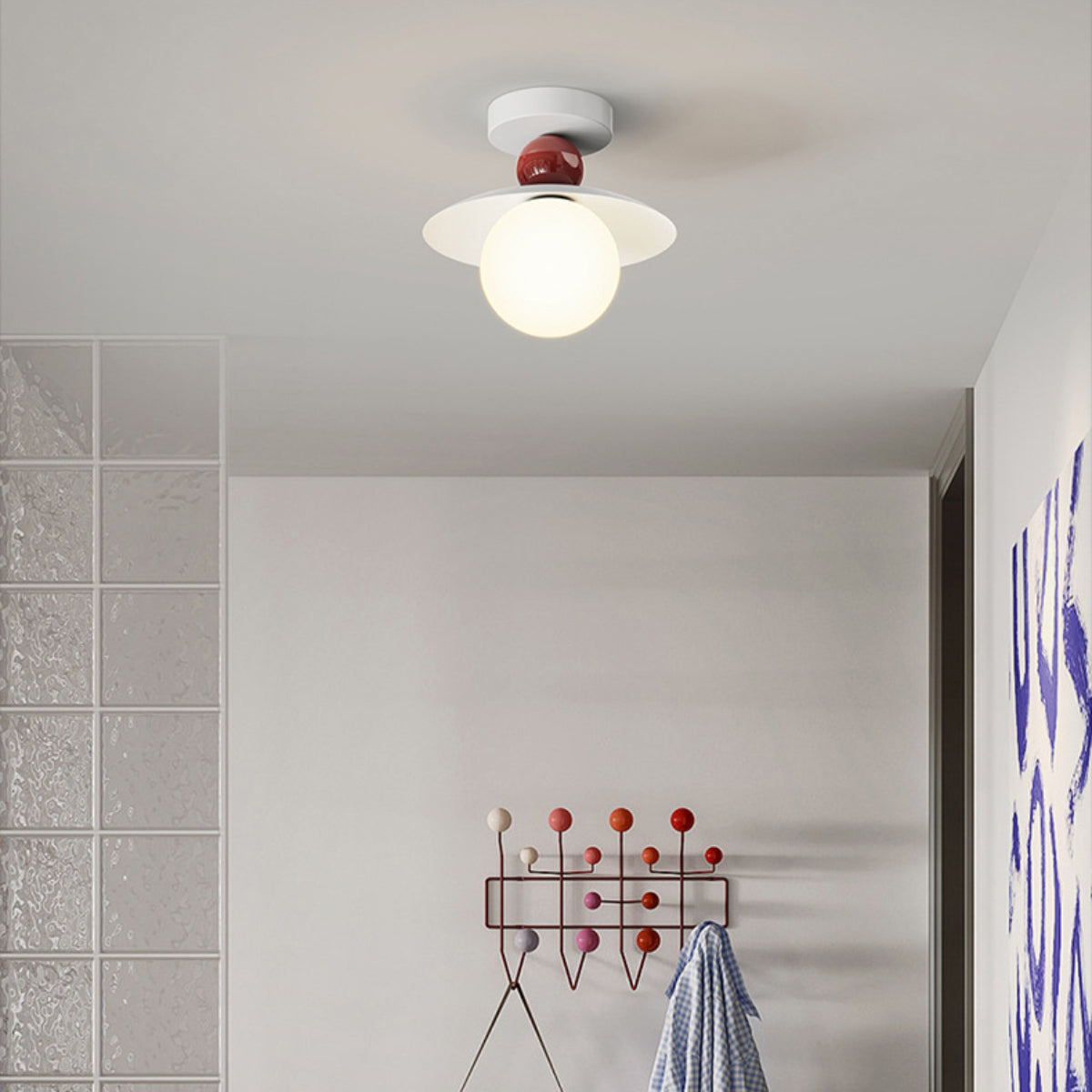 Red-accent Hailie ceiling light above a hallway coat rack