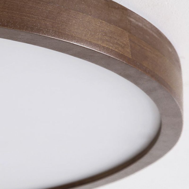 Round Ozawa ceiling light with an unlit-looking pale face inside a brown wood-grain rim.